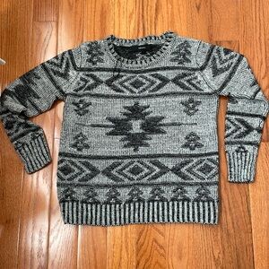 Black patterned holiday sweater.